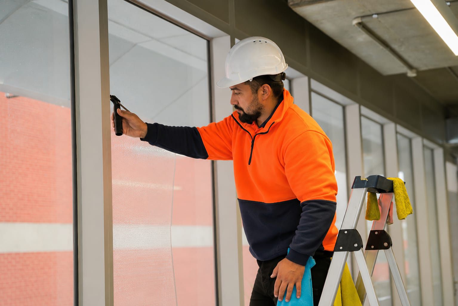 Man Cleaning the window